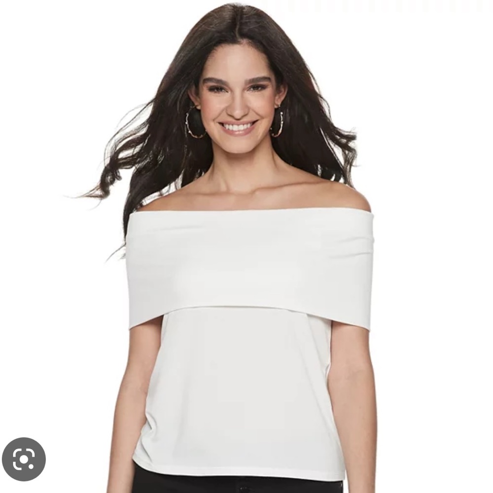 Jennifer Lopez off the shoulder white top.